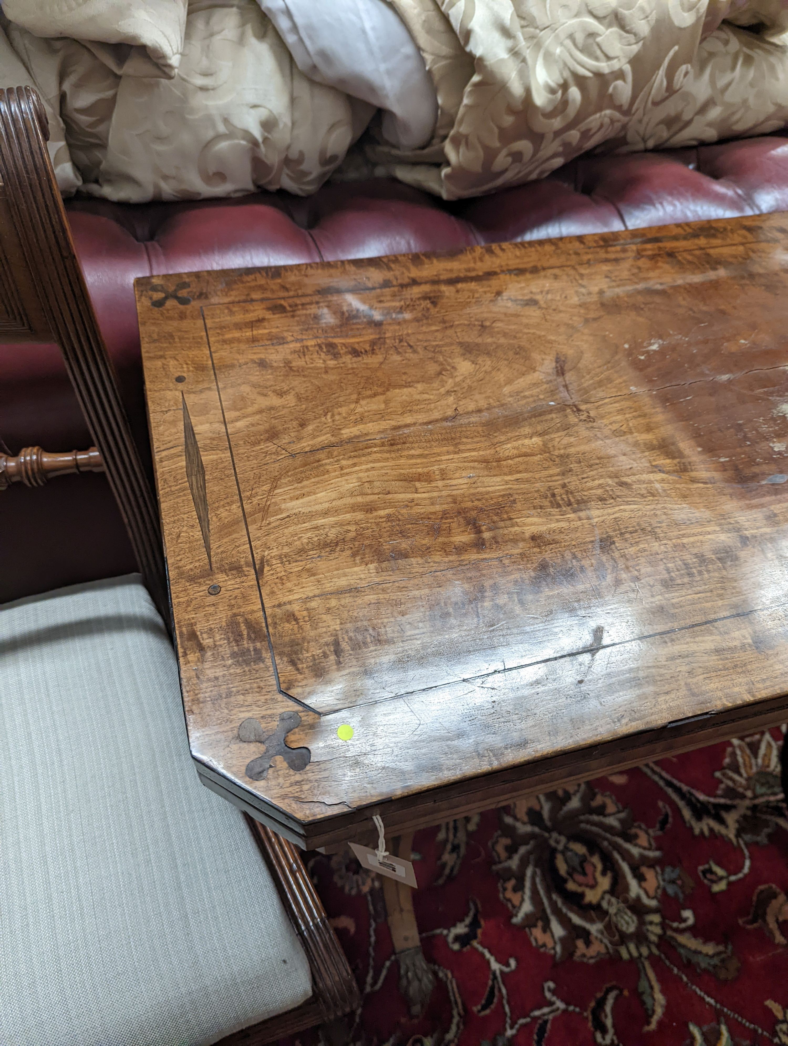 A Regency rectangular inlaid mahogany folding card table, width 91cm, depth 44cm, height 75cm